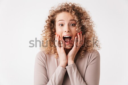 Boldog élvezetes fürtös nő beszél mobiltelefon Stock fotó © deandrobot