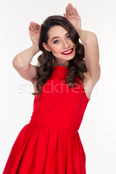 Woman showing rabbit ears with hands Stock photo © deandrobot