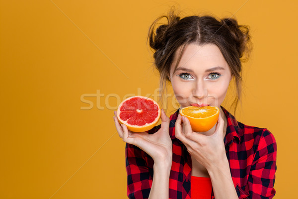 Stockfoto: Cute · jonge · vrouw · proeverij · oranje · grapefruit