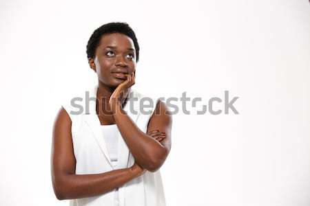 Mosolyog afroamerikai fiatal nő áll keresztbe tett kar fehér Stock fotó © deandrobot