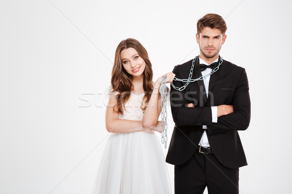 Pretty newlyweds with chain Stock photo © deandrobot