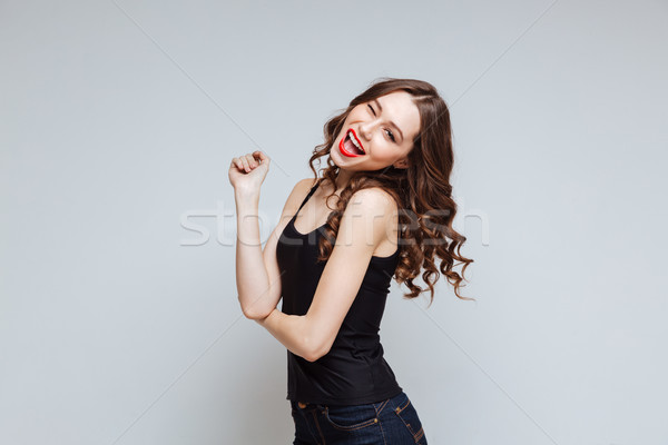 Happy woman with open mouth Stock photo © deandrobot