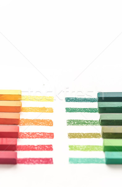 Cropped photo of colorful pastel chalks and their pigments Stock photo © deandrobot