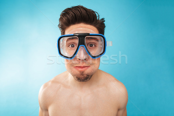 Portrait of a smiling young man in swim mask Stock photo © deandrobot