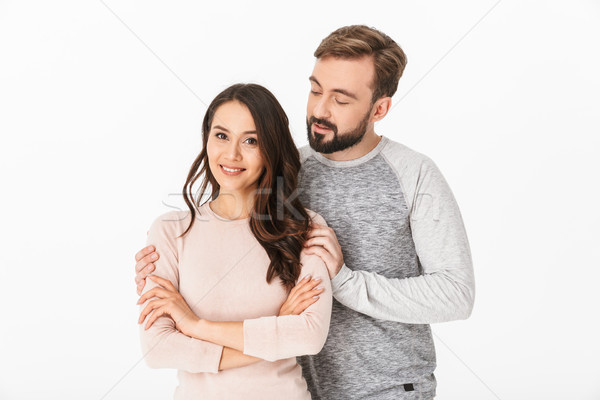 Cheerful young loving couple isolated Stock photo © deandrobot