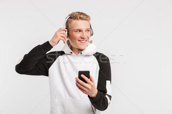 Portrait of caucasian youngster 16-18 years old wearing hoodie s Stock photo © deandrobot