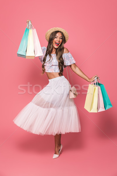 Stock photo: Full length portrait of adorable brunette woman 20s wearing stra