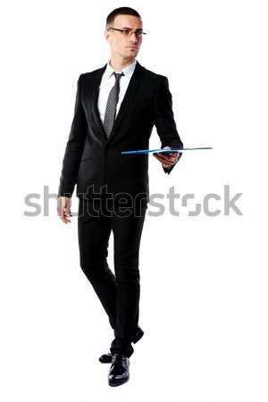 Stock photo: Cheerful asian man with arm out in a welcoming gesture