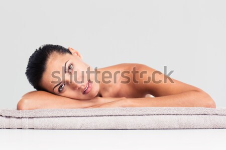 Beautiful woman lying on massage lounger Stock photo © deandrobot