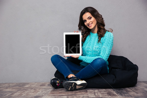 Woman showing blank tablet computer screen  Stock photo © deandrobot