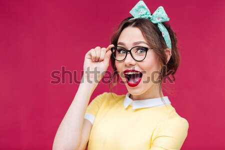 Happy funny young woman covered her eyes with marmalade candies  Stock photo © deandrobot