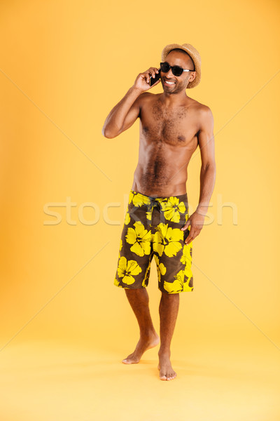 Portrait of a afro american man talking on the phone Stock photo © deandrobot