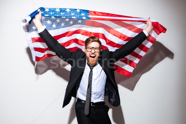 Happy Business man with USA flag Stock photo © deandrobot