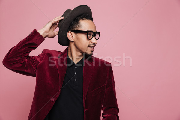 Portrait of a afro american man in hat and eyeglasses Stock photo © deandrobot