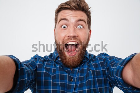 Mutlu çığlık atan sakallı adam para Stok fotoğraf © deandrobot