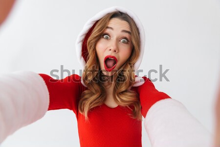 Close up portrait of a scared young girl screaming Stock photo © deandrobot