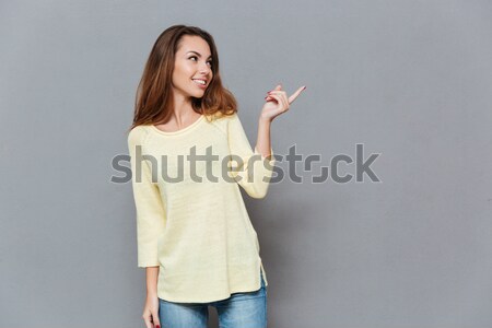 Image of candid female with red lips smiling and gesturing on ca Stock photo © deandrobot