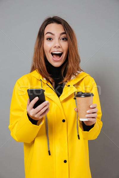 Porträt heiter Mädchen Regenmantel schauen Kamera Stock foto © deandrobot