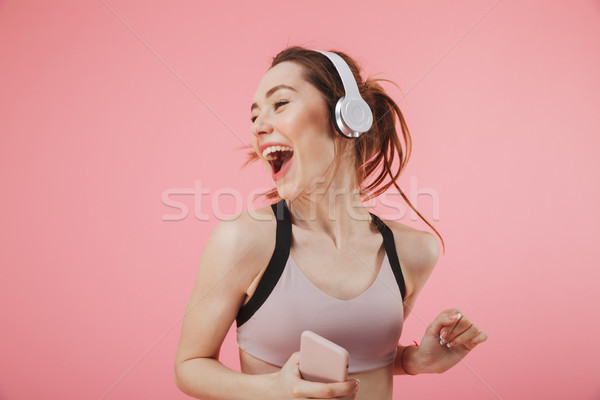 Happy young fitness sports woman Stock photo © deandrobot