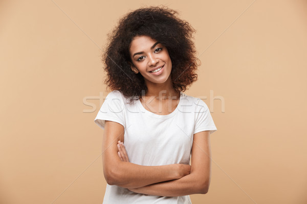 Portrait of a smiling young african woman Stock photo © deandrobot