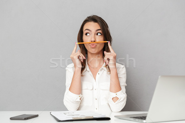 Portrait of a funny young business woman Stock photo © deandrobot