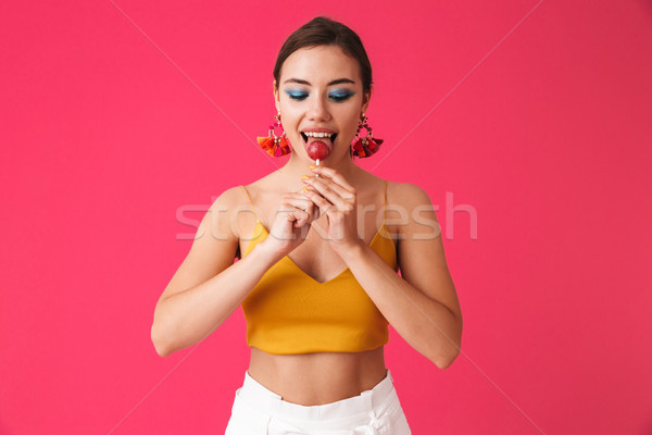 Image of beautiful glamorous woman 20s wearing earrings smiling  Stock photo © deandrobot