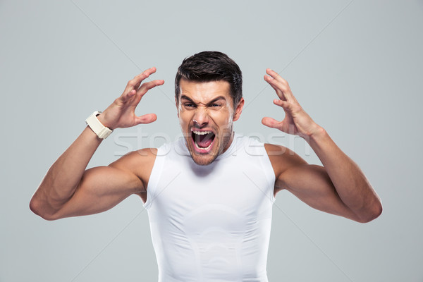Portrait of angry fitness man shouting Stock photo © deandrobot