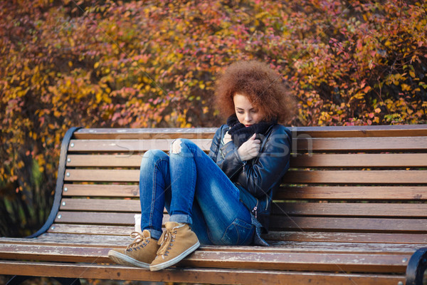 печально женщину сидят скамейке осень парка Сток-фото © deandrobot