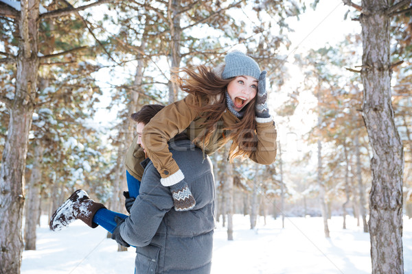 Man carrying woman on his shoulders Stock photo © deandrobot