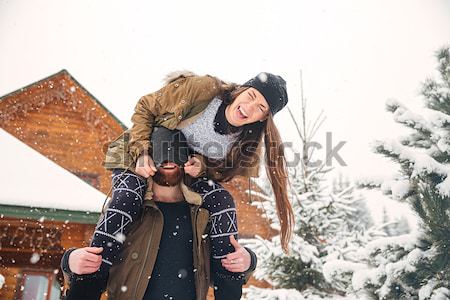 Couple having fun and laughing in winter Stock photo © deandrobot