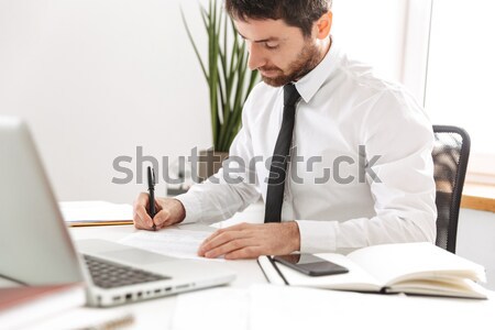 Cropped image of a smiling happy businesswoman typing on keyboard Stock photo © deandrobot