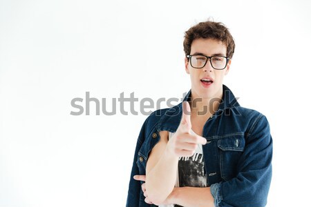 Hipster in eyeglasses pointing at camera Stock photo © deandrobot