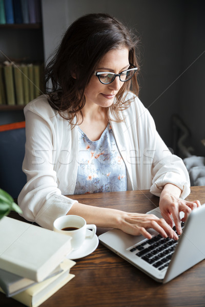 Portrait of a mature business woman working on a laptop Stock photo © deandrobot