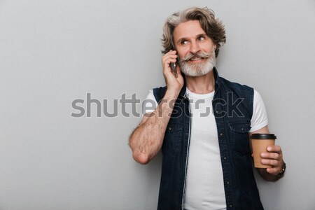 Caucasian young bearded man make silence gesture. Stock photo © deandrobot