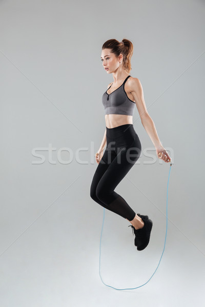 Tam uzunlukta görüntü genç spor kadın atlama Stok fotoğraf © deandrobot