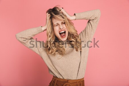 Girl in dress looking at camera with her mouth open Stock photo © deandrobot