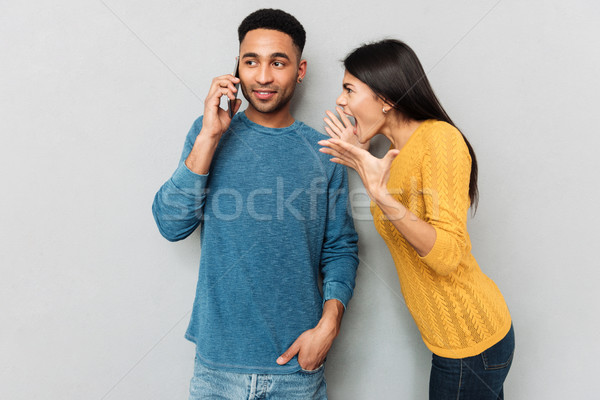 Kobieta mąż telefonu zły mówić Zdjęcia stock © deandrobot