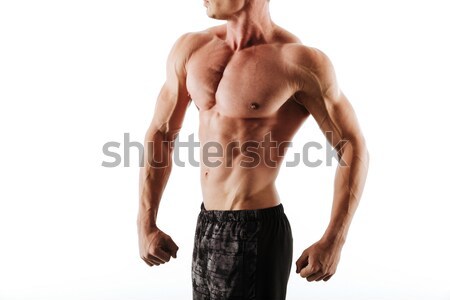 Cropped photo of sweaty athletic man in black shorts resting aft Stock photo © deandrobot