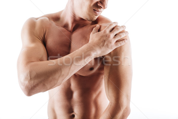 Cropped image of sportsman have a painful feelings in body. Stock photo © deandrobot