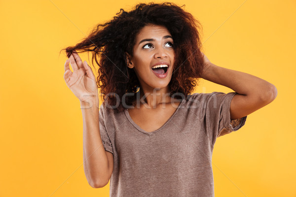 Heureux africaine femme toucher cheveux [[stock_photo]] © deandrobot