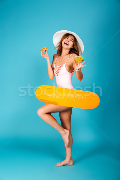 Full length portrait of a cheerful girl Stock photo © deandrobot