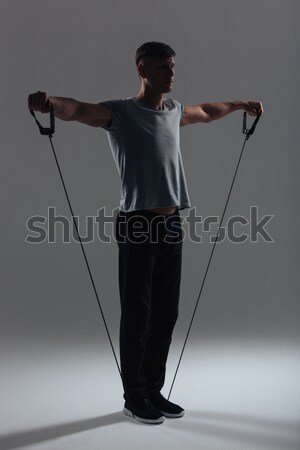 Young model posing in professionally equipped studio Stock photo © deandrobot