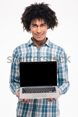 Man krulhaar tonen laptop computer scherm portret Stockfoto © deandrobot