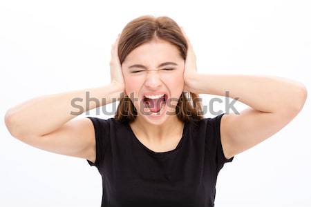 Mérges ingerült fiatal nő fedett fülek kezek Stock fotó © deandrobot
