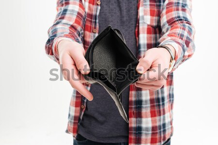 Gun holded by hands of strong young man Stock photo © deandrobot