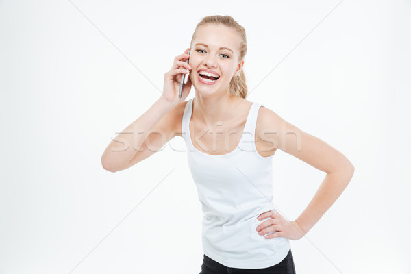 Cheerful casual woman talking on the phone Stock photo © deandrobot