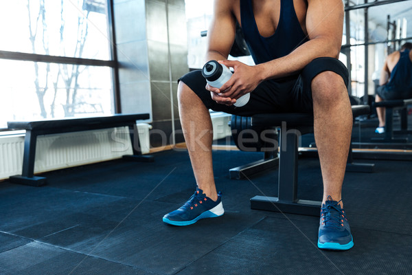 Homme une bouteille d'eau gymnase image sport [[stock_photo]] © deandrobot