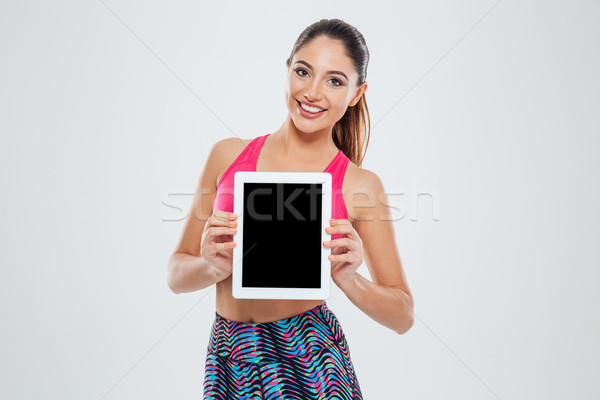Vrouw tonen scherm gelukkig fitness vrouw Stockfoto © deandrobot