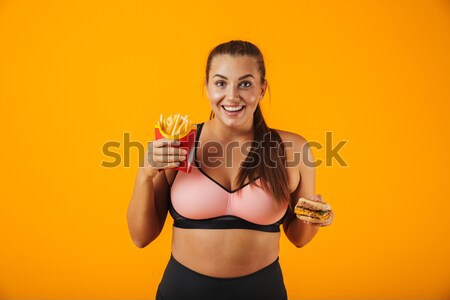 Close up of a girl in swimsuit holding glass bottle Stock photo © deandrobot