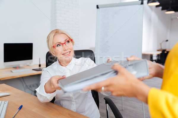 Two businesswomen cooperating in the office Stock photo © deandrobot